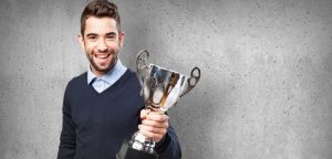 man holding a trophy